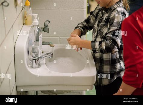 Child Washing Hands In School Sink Stock Photo Alamy