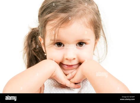 Portrait Of Cute Small Girl With Hands Under Her Chin Isolated Stock