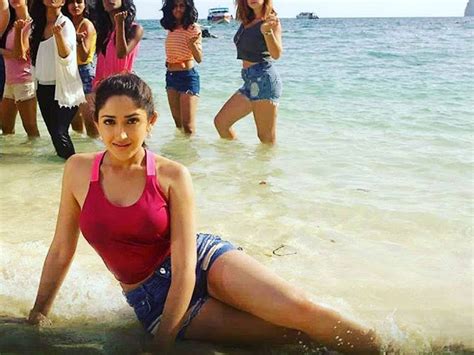 CELEBRITY PICS Sayesha Saigal Hot BOOBS In Shorts At Beach