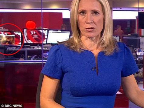 watch video of woman exposing breasts appears in background of live bbc broadcast