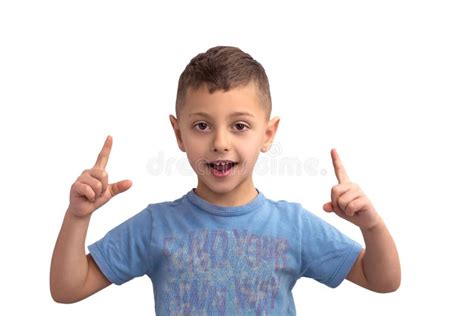 Portrait Of A Boy Who Holds Two Fingers Up Isolated On White Background