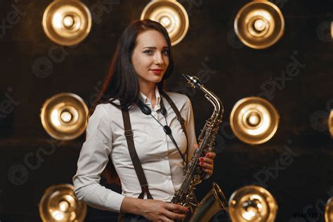 Female Saxophonist Plays The Saxophone On Stage Stock Photo Crushpixel