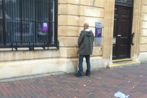 Fury After Man Caught Urinating Up Against Bank In Town Centre