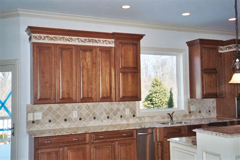 A backsplash is a part of the wall that is located between the upper and lower kitchen cabinets, directly above the work area. Where to End Kitchen Backsplash Tiles - BELK Tile