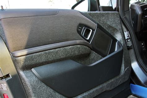 Even on the lowest bmw, still real wood on a plastic base. 2015 BMW i3 with Range Extender - Autos.ca