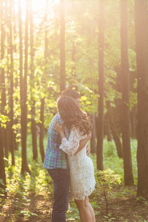 Portrait Of A Young Romantic Couple Embracing Each Other On Nature Stock Image Image Of Green