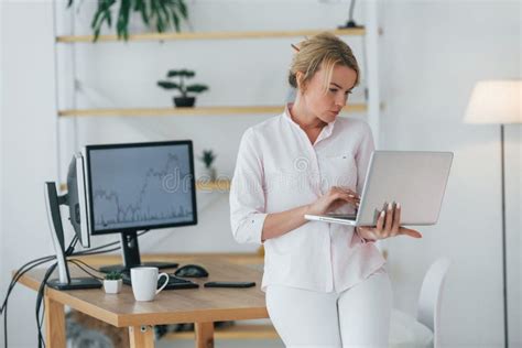 Using Smartphone To Communicate Female Stock Broker In Formal Wear Is