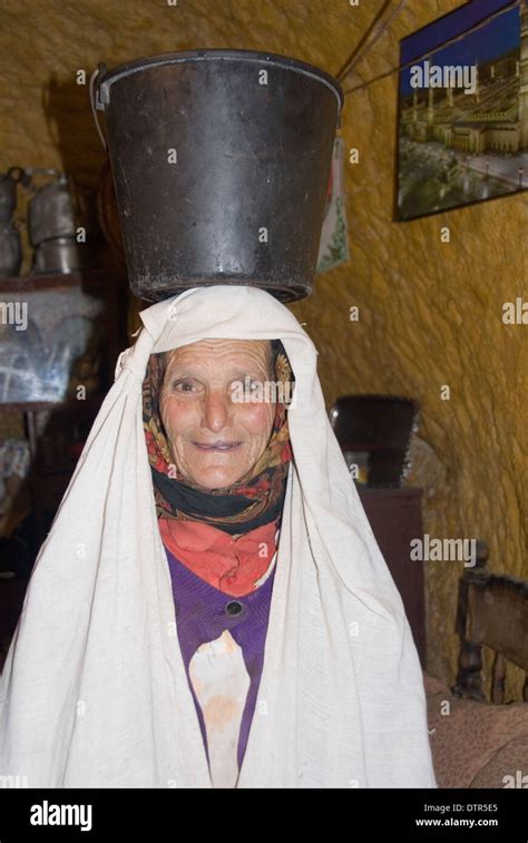Morocco Nr Fez 80 Year Old Cave Dweller In Bhalil Balancing Pail Of