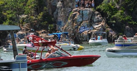 Chimney rock on lake martin in alabama is ~60 feet, people have died, broken arms, paralyzed, etc. Photo: Chimney Rock 4th of July