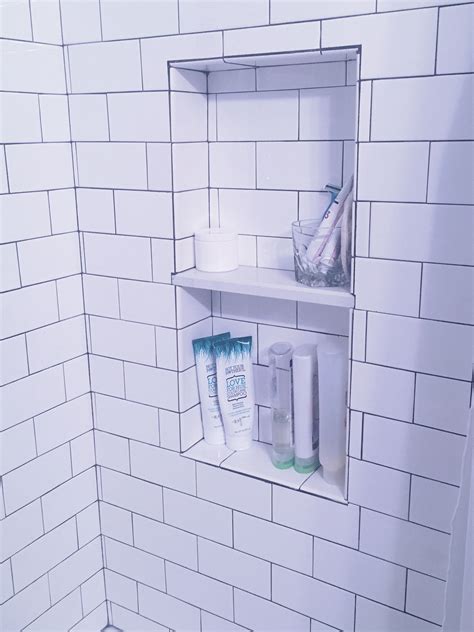 An ideal solution for both remodeling and new construction. Classic white subway tile with charcoal grout and white ...