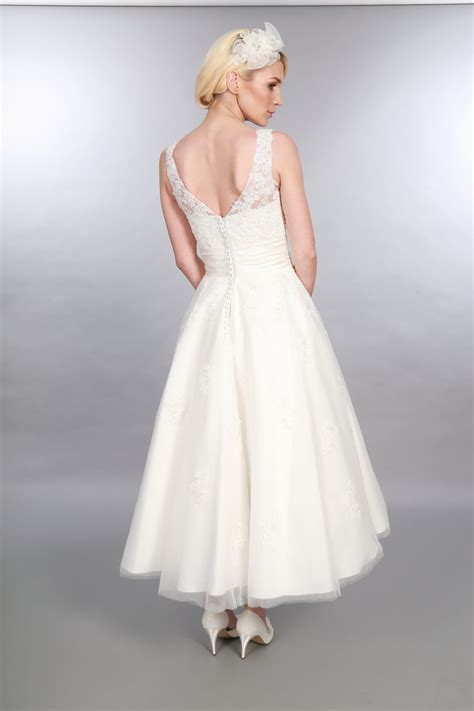 Or maybe it's a less formal, daytime wedding and you're thinking of. ANARA Lace 1950s Tea Calf Length Short Wedding Dress