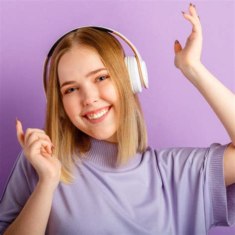 Happy Smiling Young Woman Dancing In White Headphones Teenager Girl Enjoy Listen Music Moving