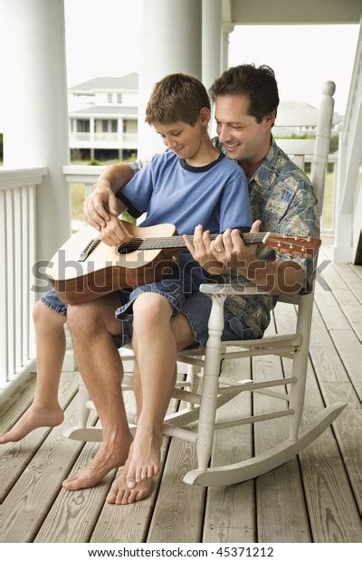 Son Sits On His Fathers Lap Stock Photo Shutterstock