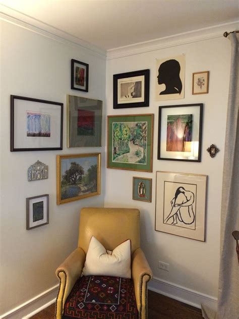 the gallery wall is tucked into an unexpected spot -- centered over a corner chair. | Corner ...