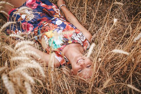 Cute Blond Girl Laying In A Wheat Field By Stocksy Contributor Paff