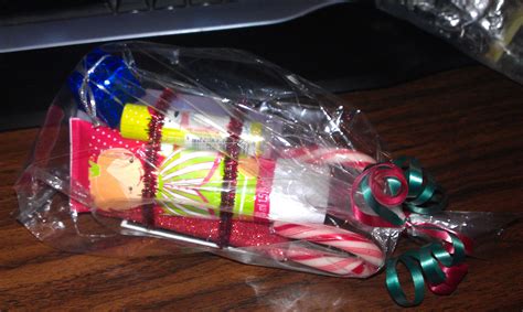 Mini Christmas Hand Lotion Lip Balm And Bubble Bath Placed On A Candy