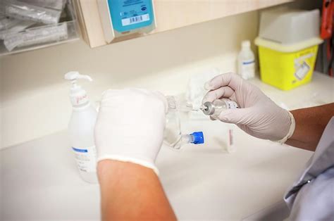 Nurse Preparing Drugs Photograph By Arno Masseescience Photo Library