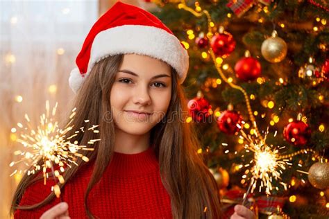 Cheerful Girl With Bengal Fires Near Christmas Tree Stock Photo Image