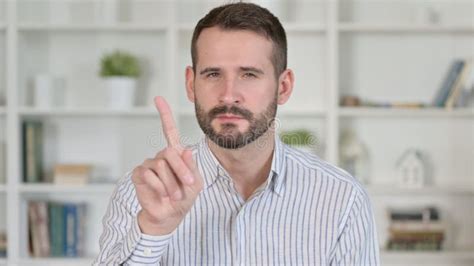 Portrait Of Young Man Saying No With Finger Sign Stock Image Image Of