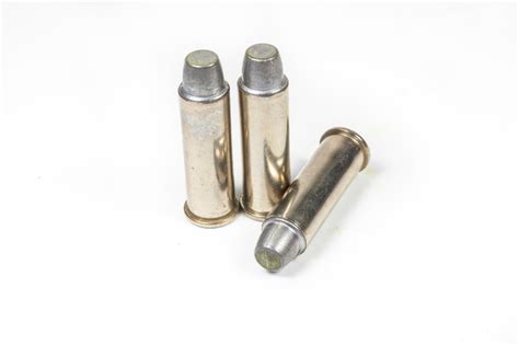 Premium Photo Bullets For 38 Revolver Hand Gun On White Background