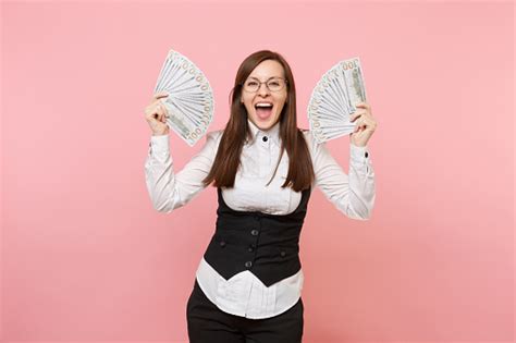 Young Overjoyed Business Woman In Glasses Holding Bundle Lots Of