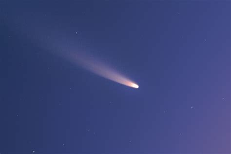 Close Up View Of Comet Neowise Against A Colorful Predawn Sky