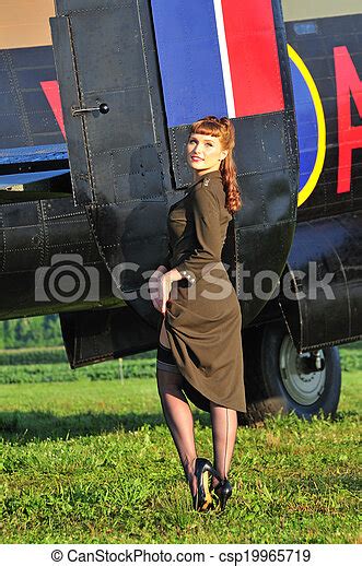 Army Pinup Girl With Wwii Bomber Sexy Woman In An Army Dress Standing