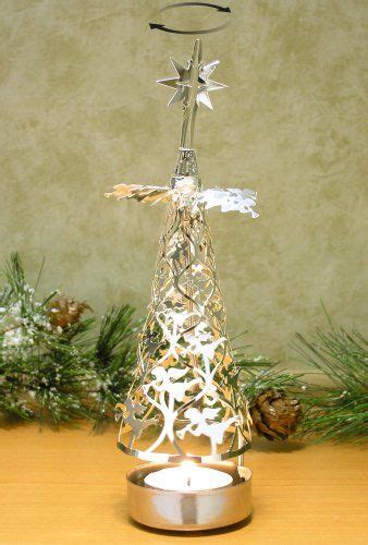 A decorative accessory with and without candles. Spinning Christmas Tree Candle Holder with Angels ...