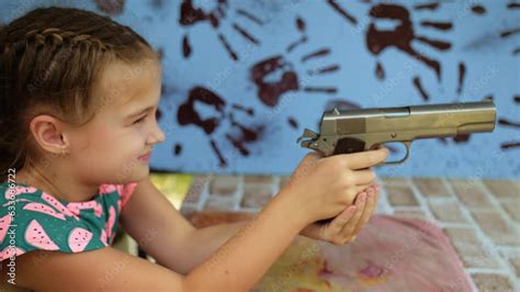 Little Girl Shoots At Shooting Range With Gun Outdoors Entertainment
