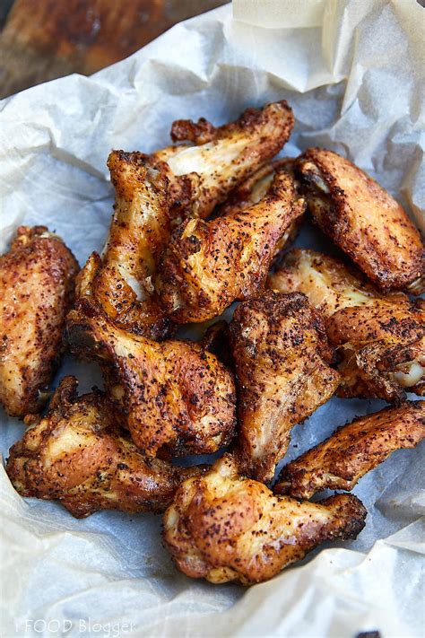 Breaded fried chicken wings, fingers and drumsticks on wooden rustic background. Extra Crispy Air Fryer Chicken Wings - i FOOD Blogger