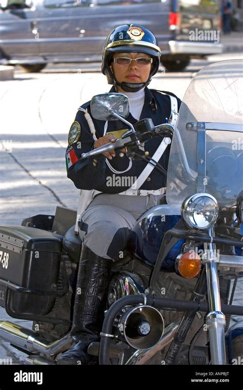 Female Police Officer Riding A Motorcycle In Mexico City Mexico Stock
