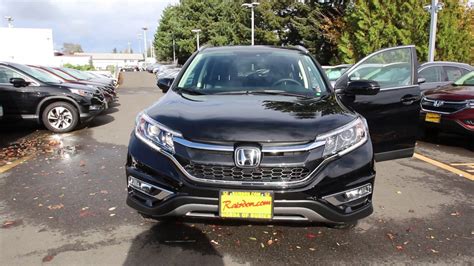 Black bodyside cladding and black wheel well trim. 2016 Honda CR-V Touring | Crystal Black | GL003784 ...