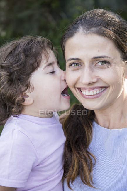 Portrait Of Happy Mother With Little Daughter Kissing Her — Intimacy