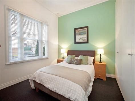 Here's another cosy space featuring green bedroom walls. mint green feature wall - Google Search | Feature wall ...