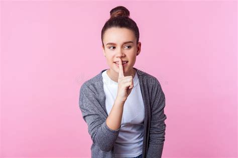 Keep In Secret Portrait Of Playful Positive Brunette Teen Girl Showing Hush Silence Gesture