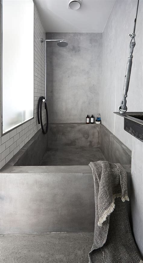 Concrete sink with integral towel holder. Concrete bathtub. Designed by Sander Forbes Rolfsen