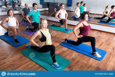 Adults Having Yoga Class In Sport Club Stock Photo Image Of Clothes