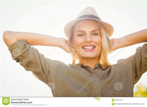 smiling blonde with arms behind the head stock image image of light life 56812183