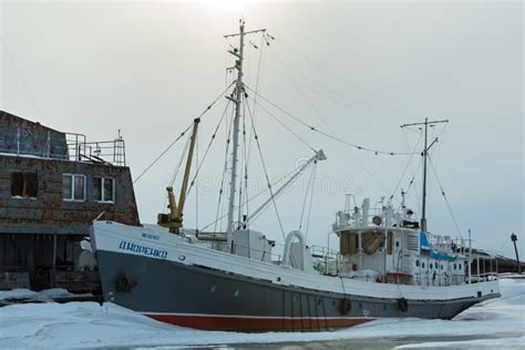 Ship In Frozen Lake Covered With Snow In Winter Evening Editorial Stock