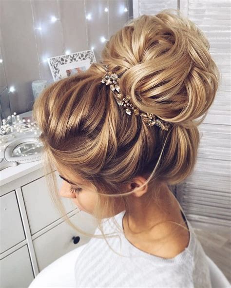 This Beautiful High Bun Wedding Hairstyle Perfect For Any Wedding Venue