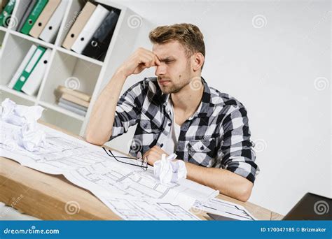 Young Adult Architect Businessman Working In Modern Studio With