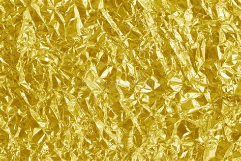 Shiny Gold Foil Texture Background Pattern Of Yellow Wrapping Paper