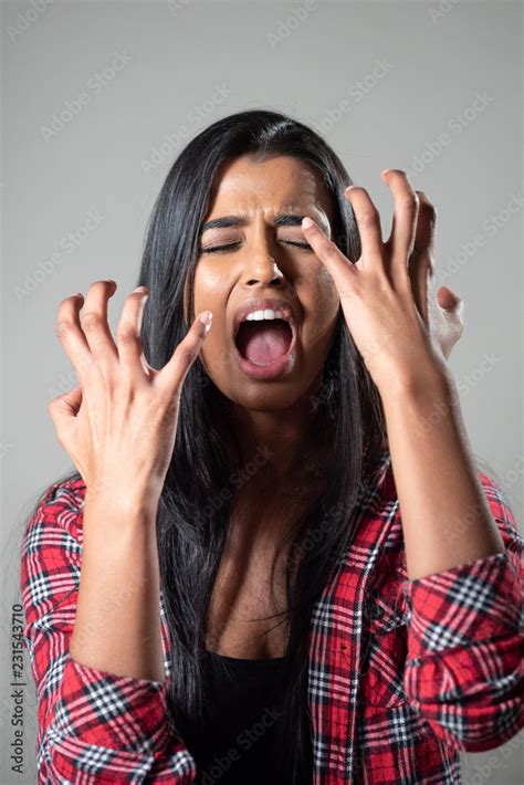 Ethnic Woman Screaming Crying In Panic Studio Portrait Stock Photo