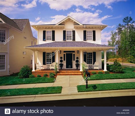 The cianna plan is a wonderful modern farmhouse style plan with stunning curb appeal. Small Two Story White House With Black Shutters Brick ...