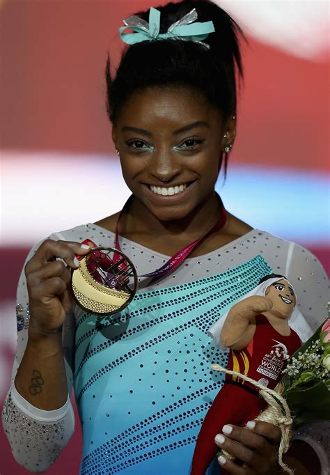 simone biles is first to win four all around titles at worlds