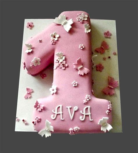 Girls number one 1st birthday cake in pink with flowers and butterflies