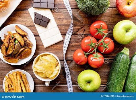 Healthy And Unhealthy Food Concept Fruit And Vegetables Vs Sweets And
