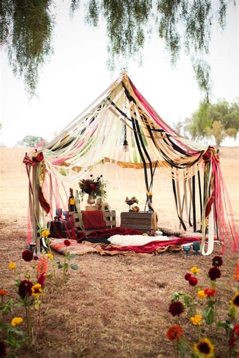 a decorated tent in the middle of a field