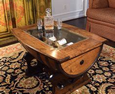 Wine barrel coffee tables and stools work well with a rustic style. Whiskey Barrel Coffee Table with Glass Top | DIY in 2019 ...