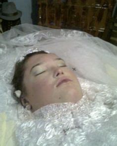 This video shows beautiful women in their funeral caskets! Andreea Brazovan in her open casket during her burial ...